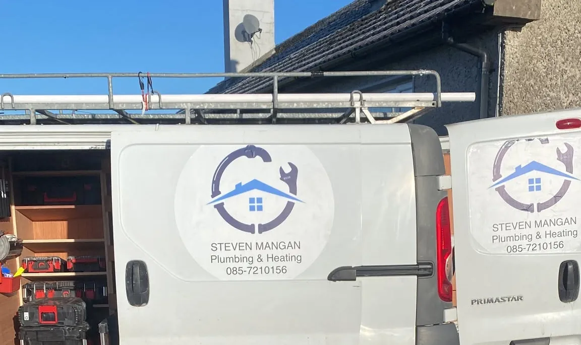 Steven Mangan Plumbing & Heating vans with the logo on the doors